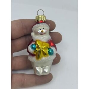 Glass Blown Snowman Holding Northern Star Christmas Ornament